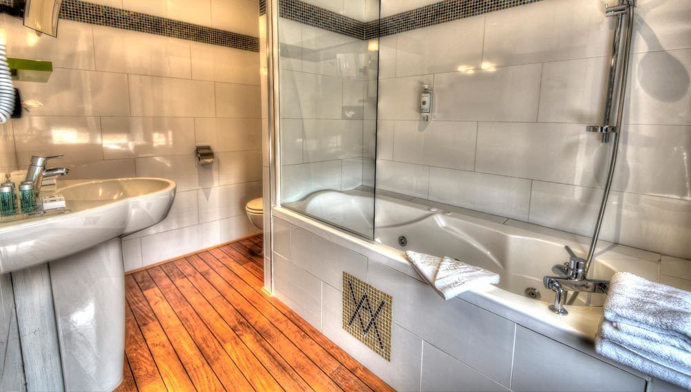 comfort double room | bathroom | bathtub, jetted bath, designer toiletries, hair dryer