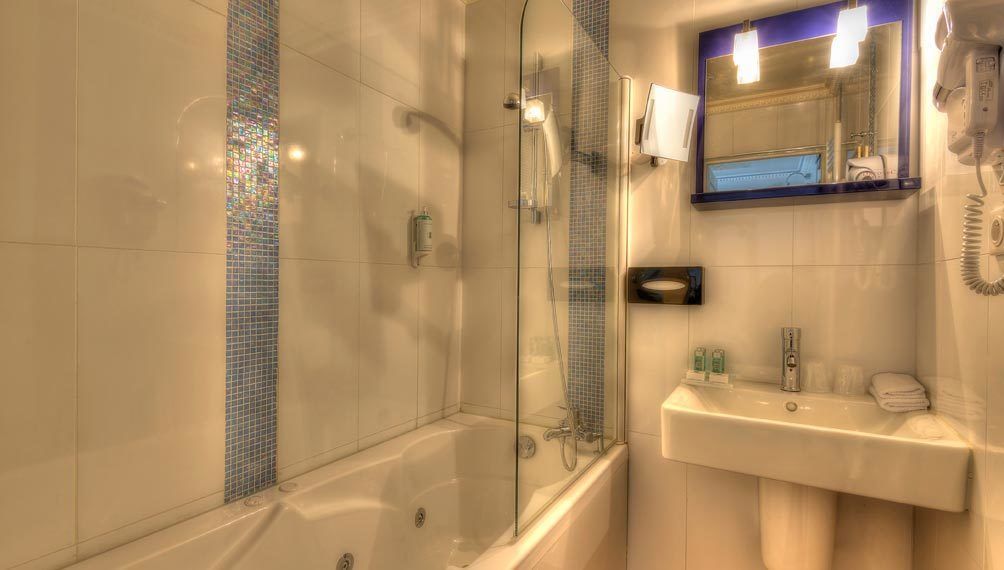 comfort double room | bathroom | bathtub, jetted bath, designer toiletries, hair dryer