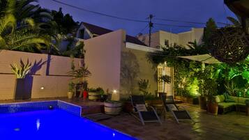 Seasonal outdoor pool, pool umbrellas, pool loungers