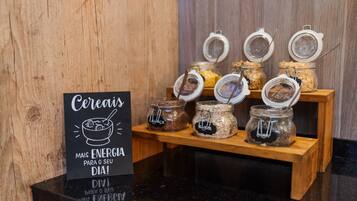 A breakfast display with cereal jars and a sign promoting energy for the day.