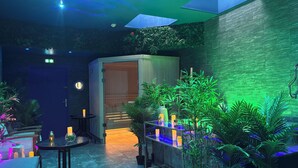 A modern interior with a bar area, seating, and a sauna. - Hôtel & SPA Le Gambetta, Centre-ville, Bergerac (Bergerac)