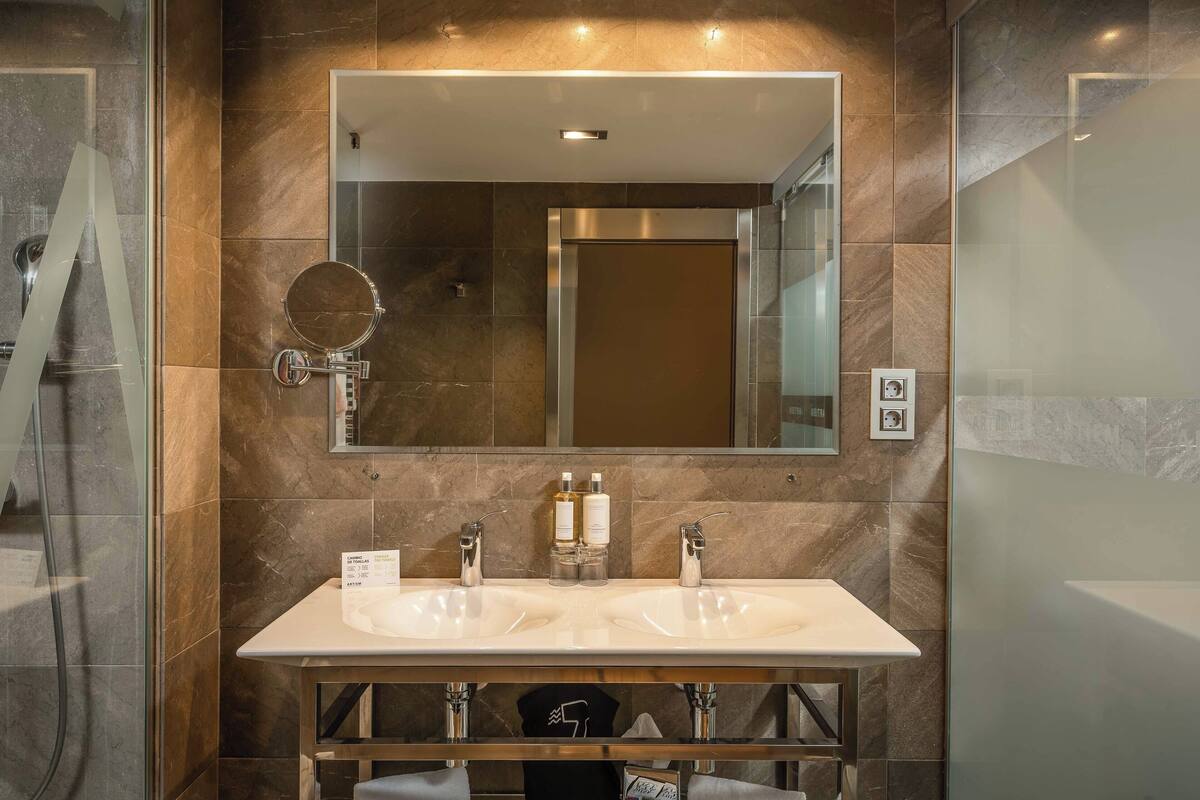 hair dryer, bathrobes, bidet, towels