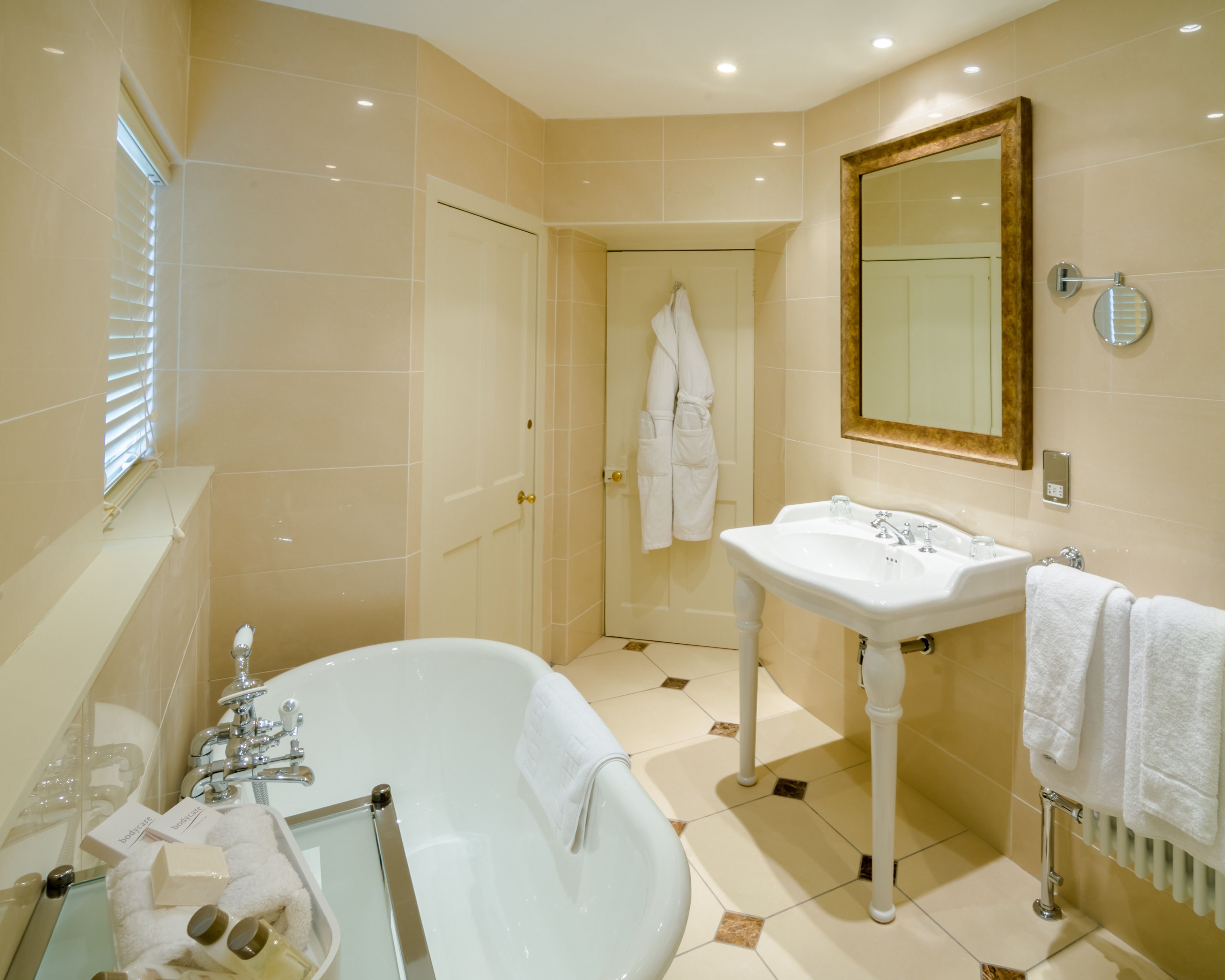 large main house room | bathroom | deep-soaking bathtub, free toiletries, hair dryer, bathrobes
