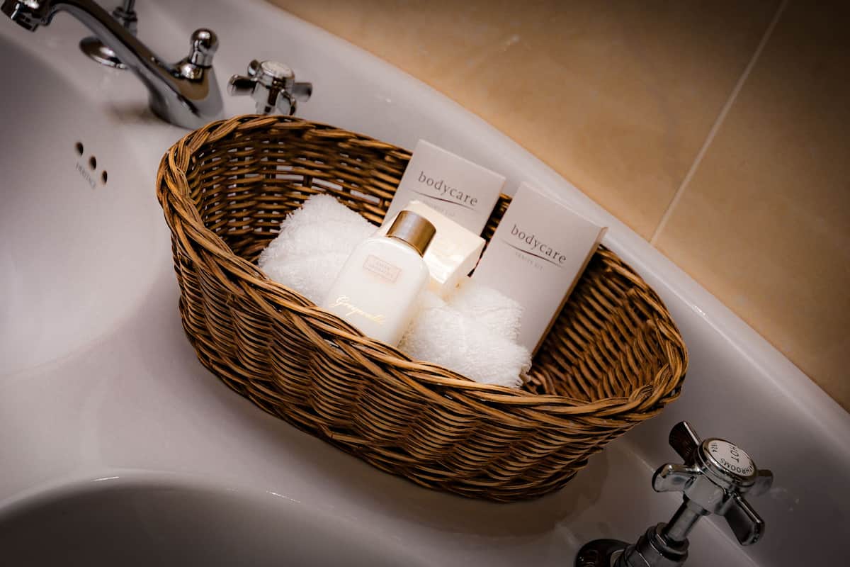 large main house room | bathroom amenities | deep-soaking bathtub, free toiletries, hair dryer, bathrobes