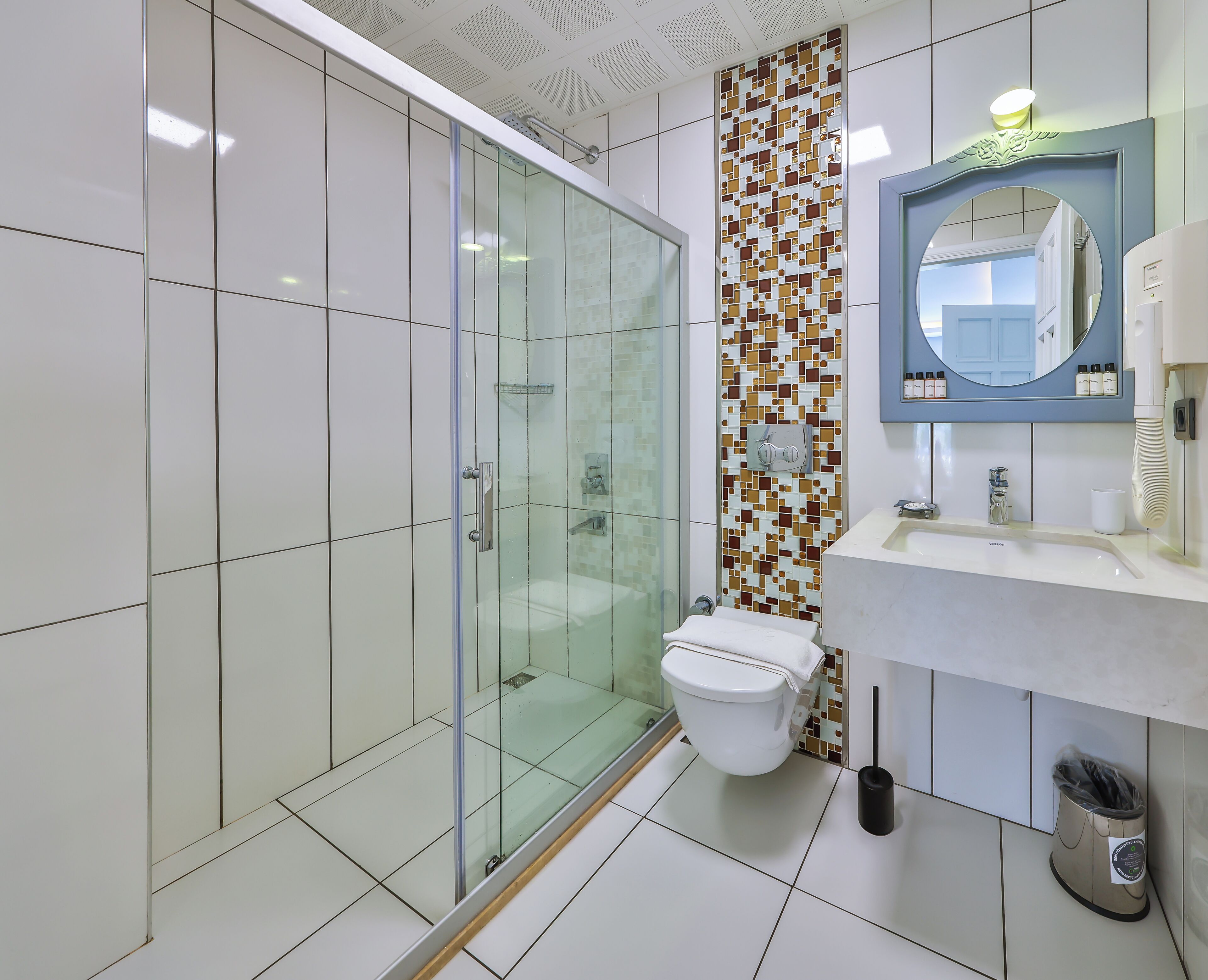 deluxe triple room | bathroom | combined shower/bathtub, rainfall showerhead, hair dryer, bathrobes