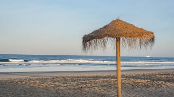 Beach nearby, white sand, beach towels
