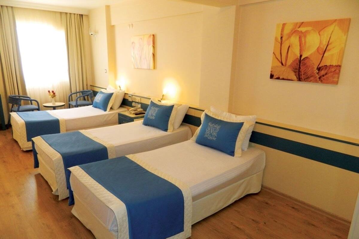 Triple Room | Minibar, in-room safe, desk, free cots/infant beds
