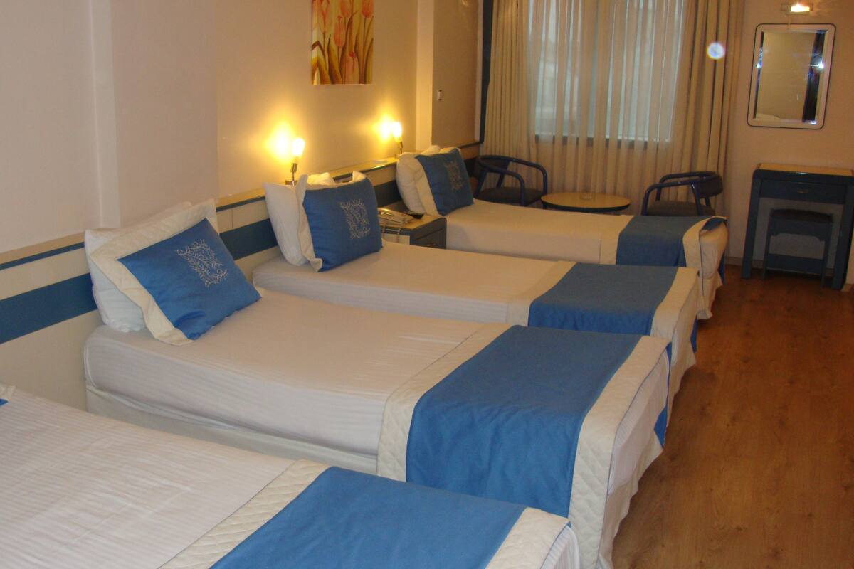 Quadruple Room | Minibar, in-room safe, desk, free cots/infant beds