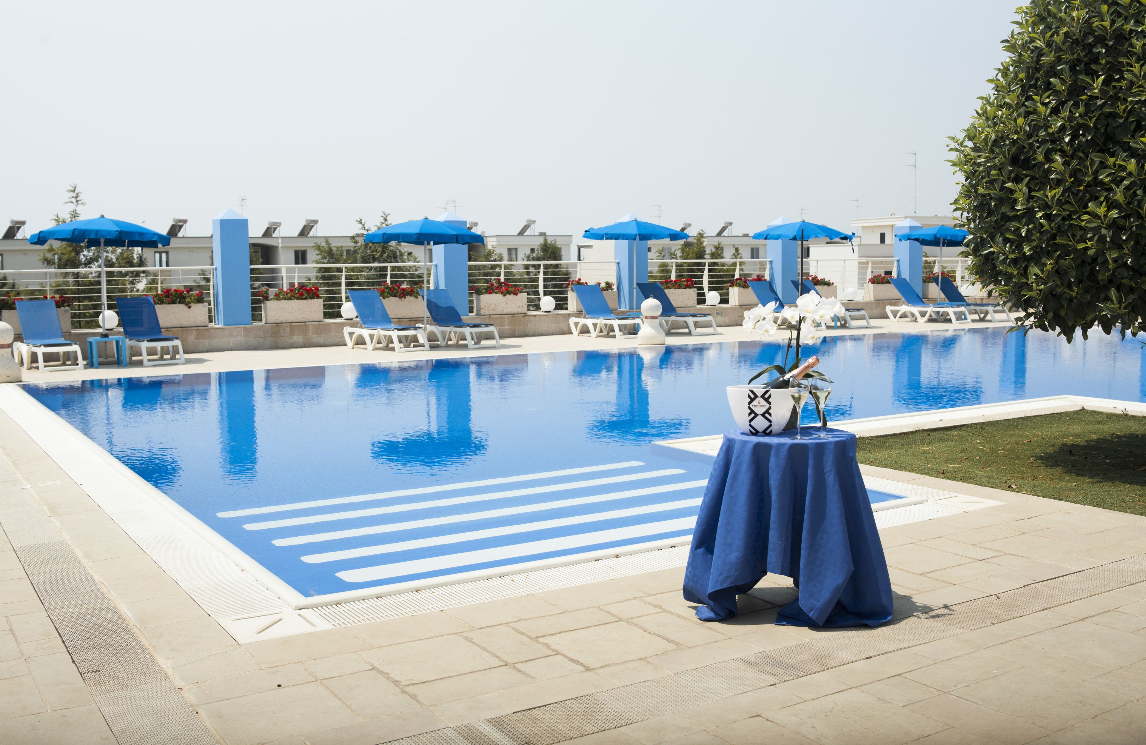 outdoor pool, pool umbrellas, pool loungers