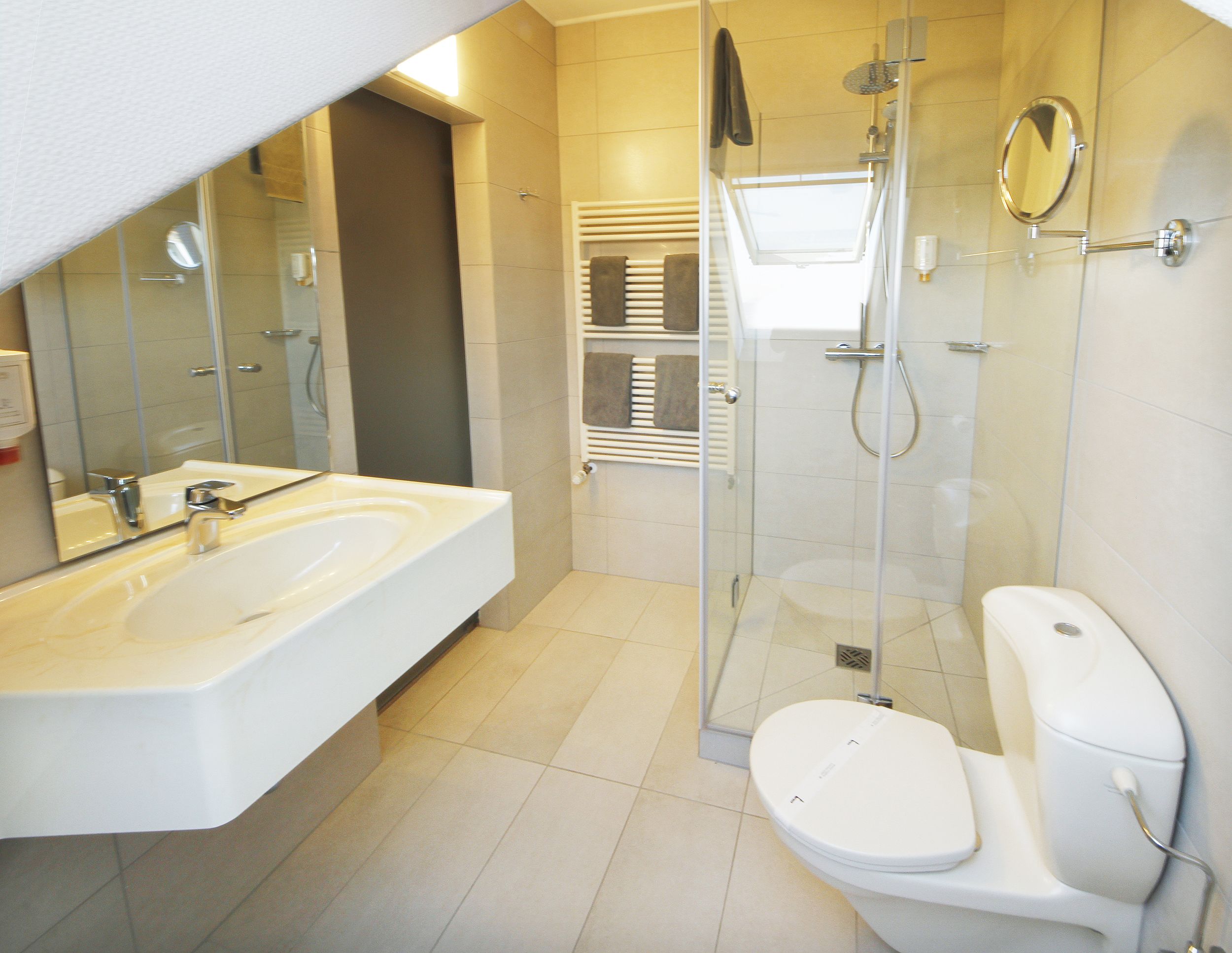 shower, rainfall showerhead, hair dryer, towels