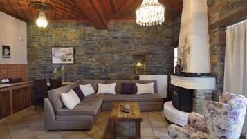 Deluxe Suite, Fireplace, Pool View | Premium bedding, minibar, iron/ironing board, free WiFi