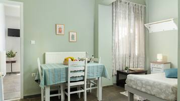 Panoramic Studio, Sea Facing (Village and Sea View) | Living area | LED TV