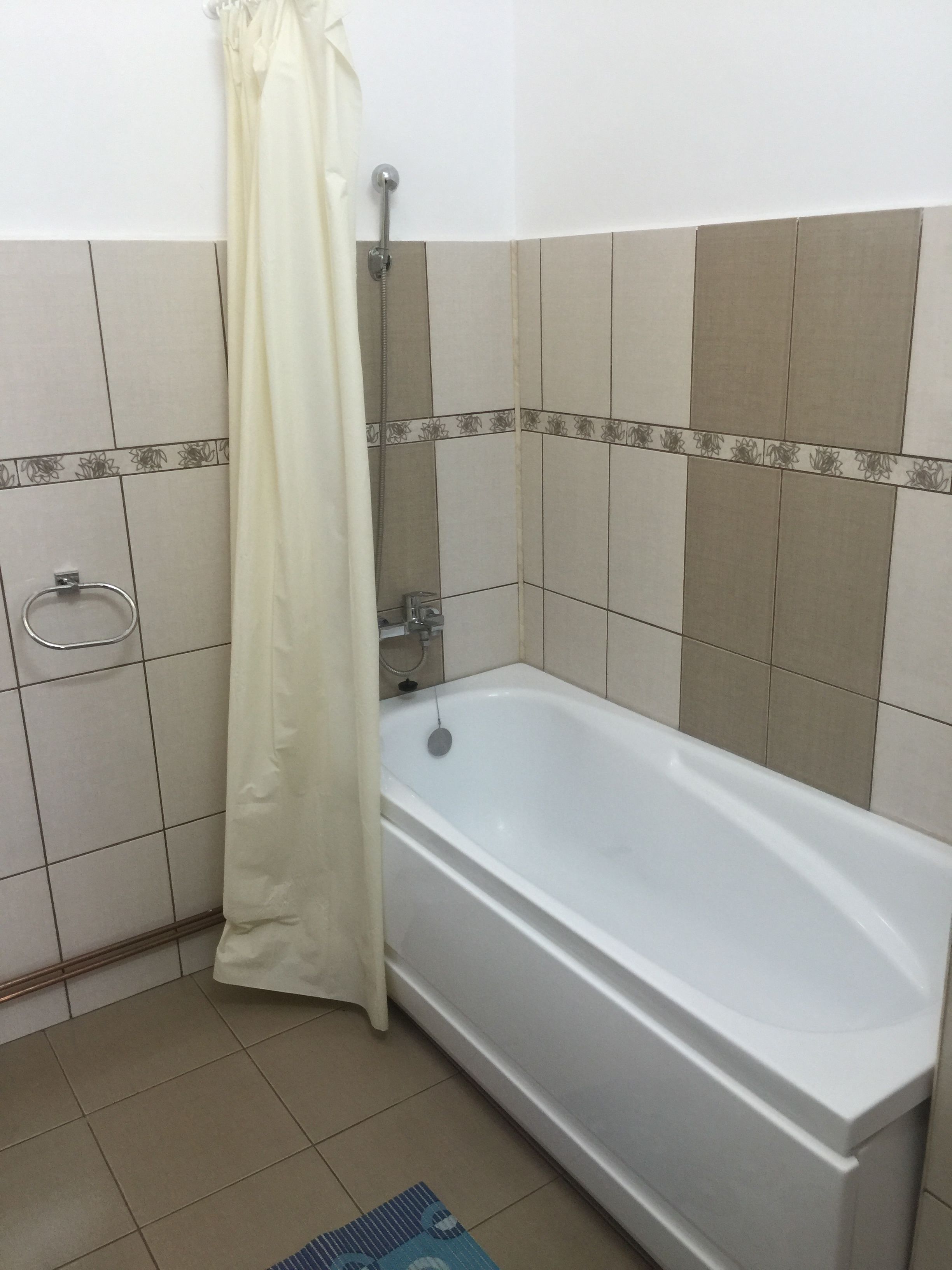 A bathroom with a bathtub, a shower, and a toilet.