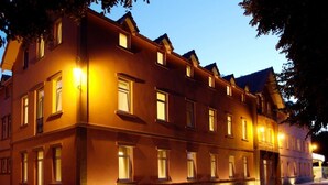A multi-story building with evenly spaced windows and a consistent architectural style. - Palace Hotel & Spa Termas de São Vicente (Penafiel)