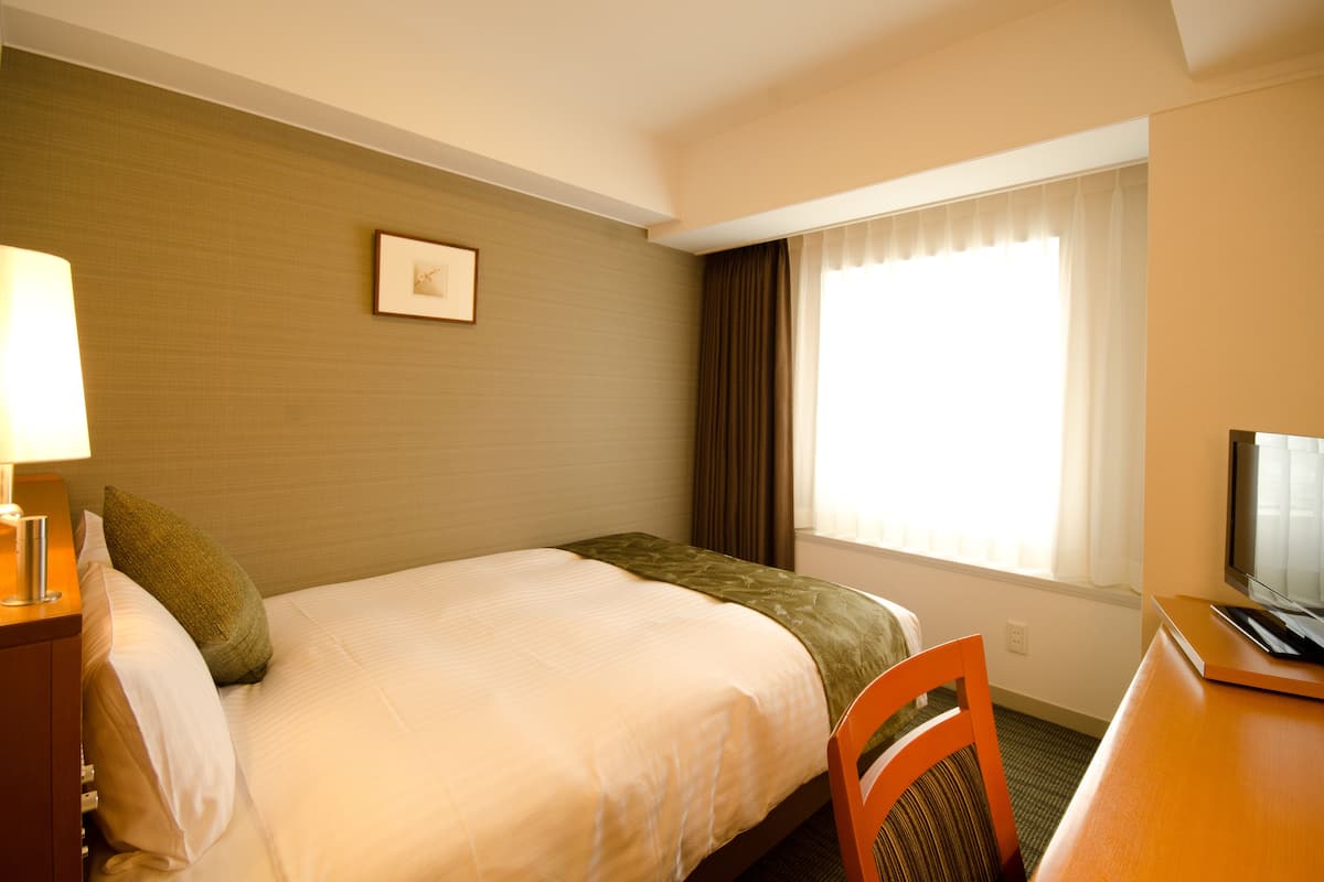 Premium bedding, down duvets, in-room safe, desk