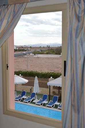 Junior Suite, 1 Bedroom, Non Smoking, Pool View | 1 bedroom, Egyptian cotton sheets, premium bedding, in-room safe