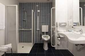 Standard Room, Accessible, Non Smoking (Mobility Tub) | Bathroom | Rainfall showerhead, free toiletries, hair dryer, bidet - Holiday Inn Milan Nord Zara by IHG (Cinisello Balsamo)