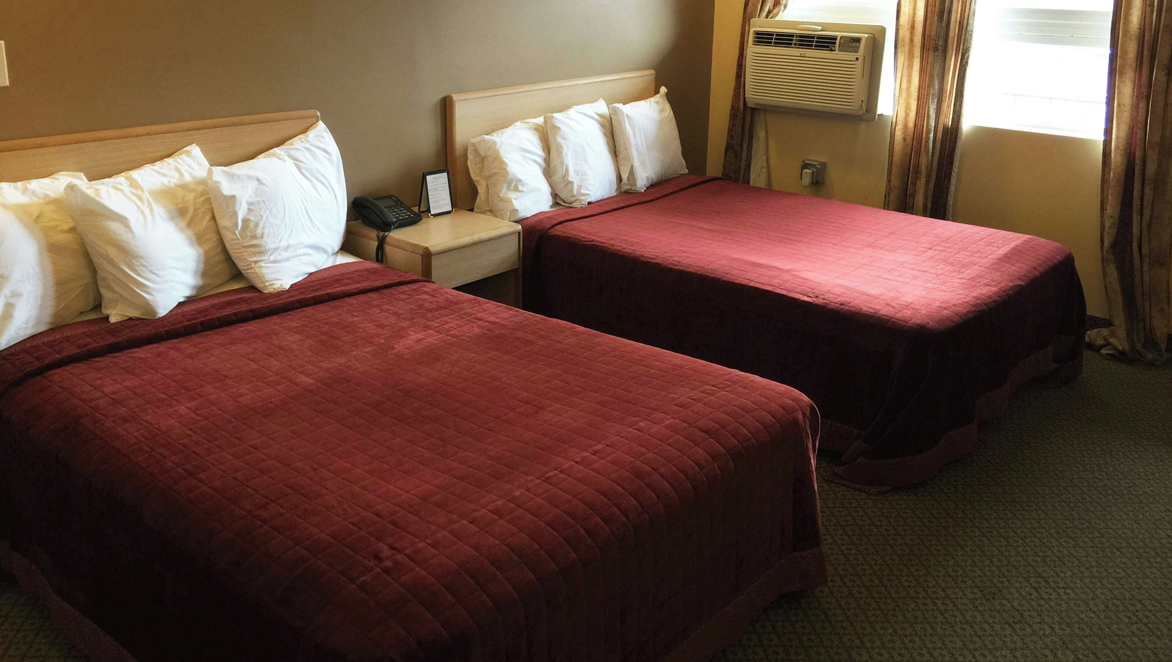 Deluxe Suite, Multiple Beds, Non Smoking | Individually furnished, desk, iron/ironing board, free WiFi