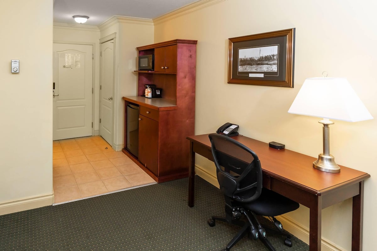 Desk, laptop workspace, blackout curtains, iron/ironing board