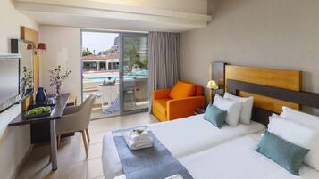 Twin Room, Pool View | Minibar, in-room safe, desk, laptop workspace