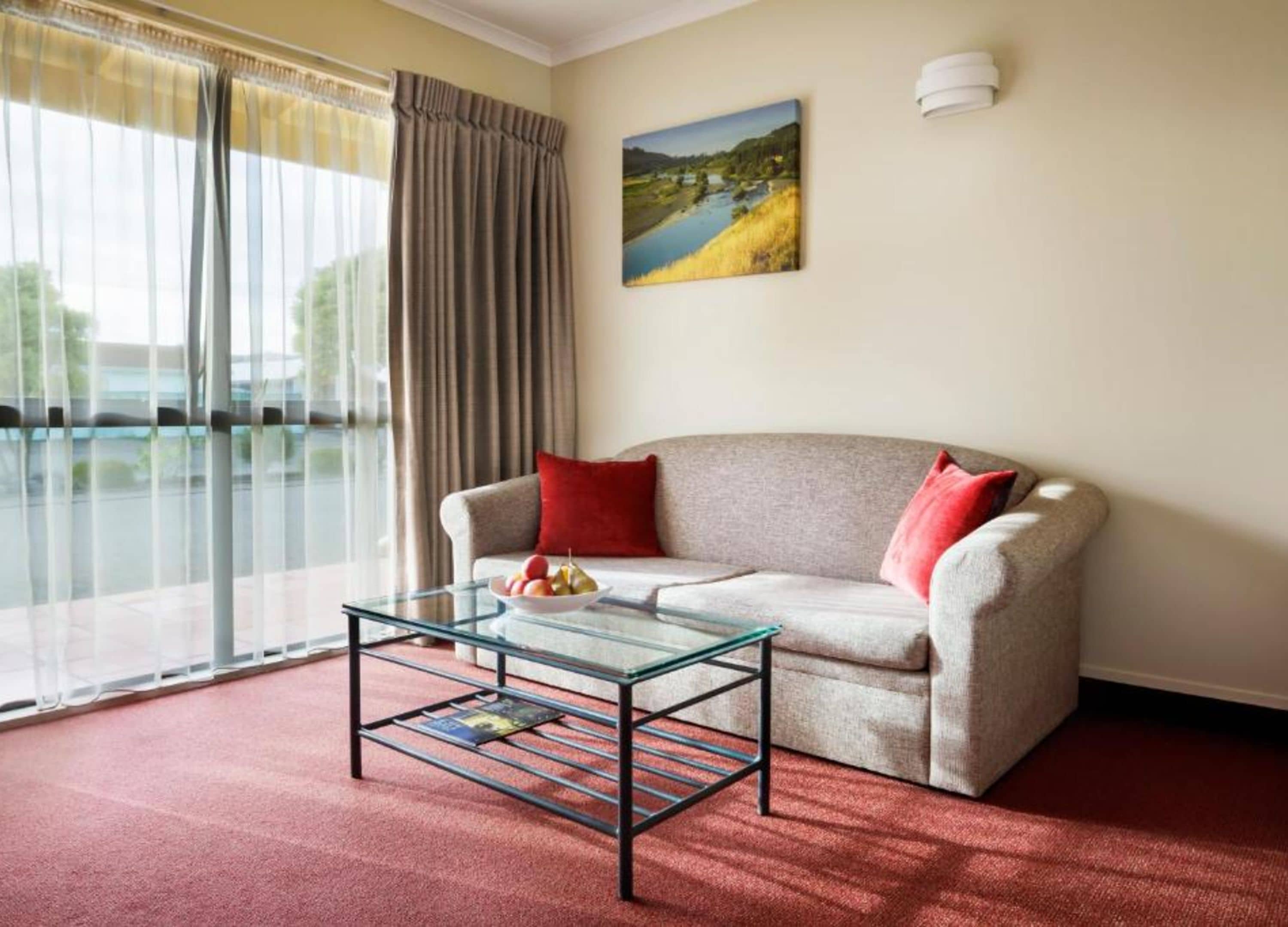 One Bedroom Suite | Living room | 32-inch LCD TV with satellite channels, TV, iPod dock