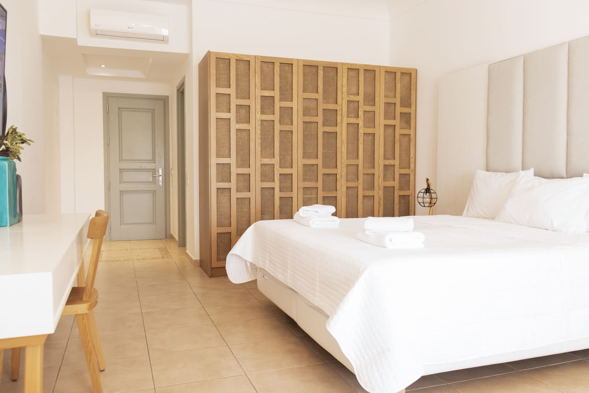 Habitación superior | Ropa de cama de alta calidad y minibar