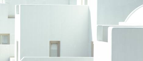 A modern building with a minimalist design, featuring clean lines and a neutral color palette.