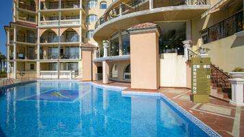 Outdoor pool, pool umbrellas, sun loungers