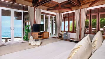 Prime Seafront Family Suite Villa | Minibar, desk, laptop workspace, blackout curtains