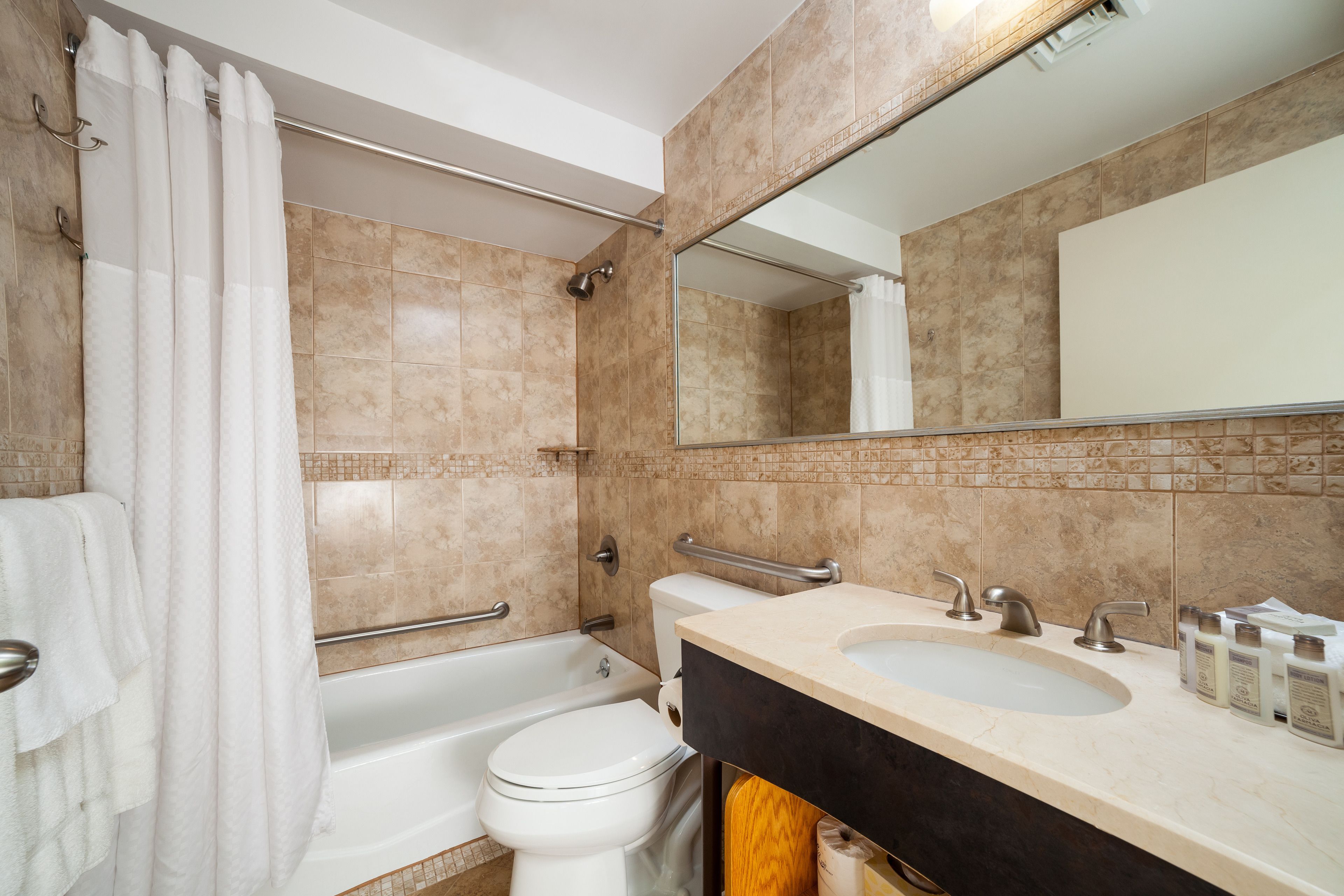 deluxe room, 2 queen beds | bathroom | hair dryer, towels