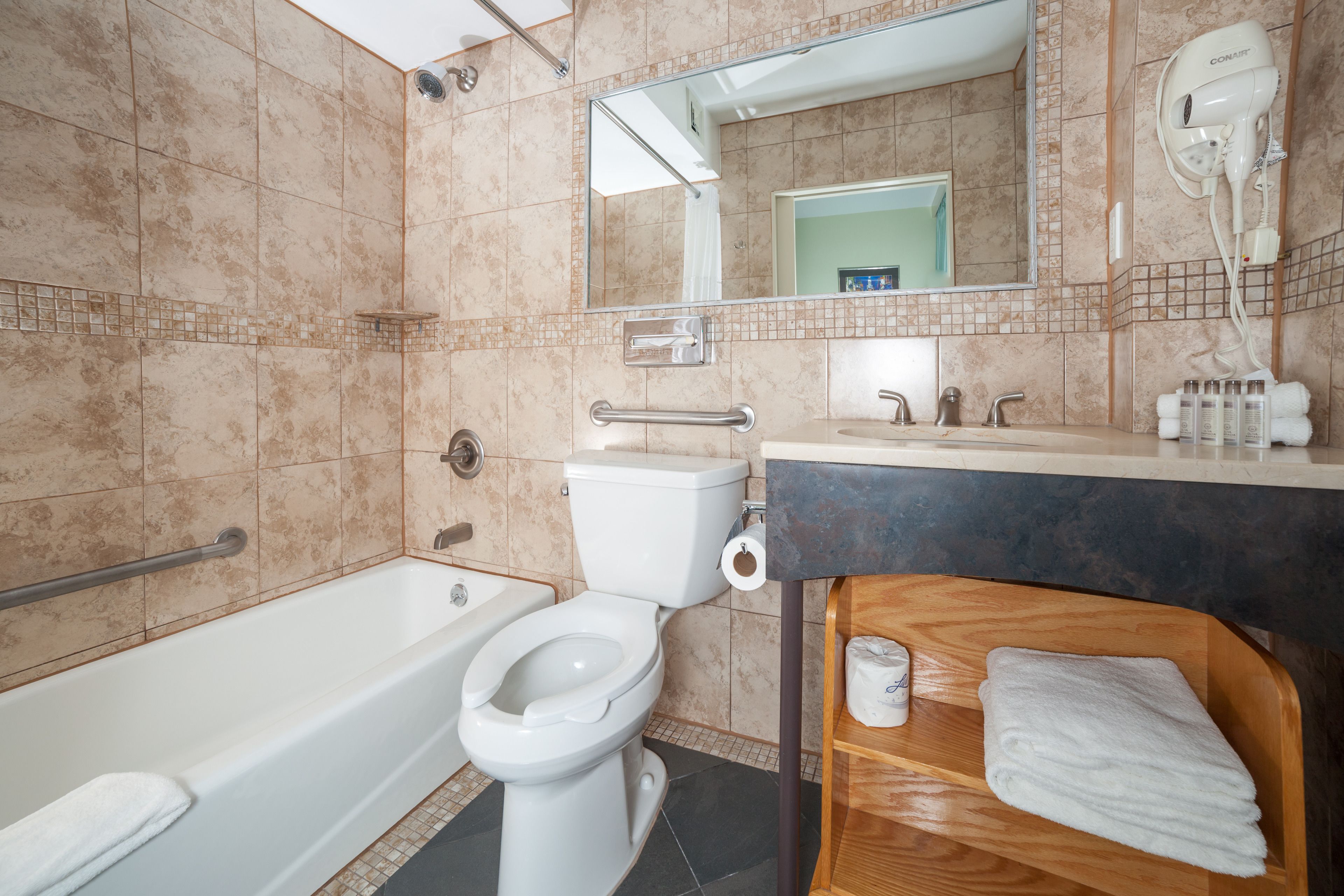 deluxe room, 1 king bed | bathroom | hair dryer, towels