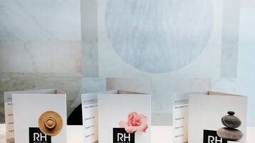 Three hotel welcome cards with the logo 'RH HOTELS' and contact information.
