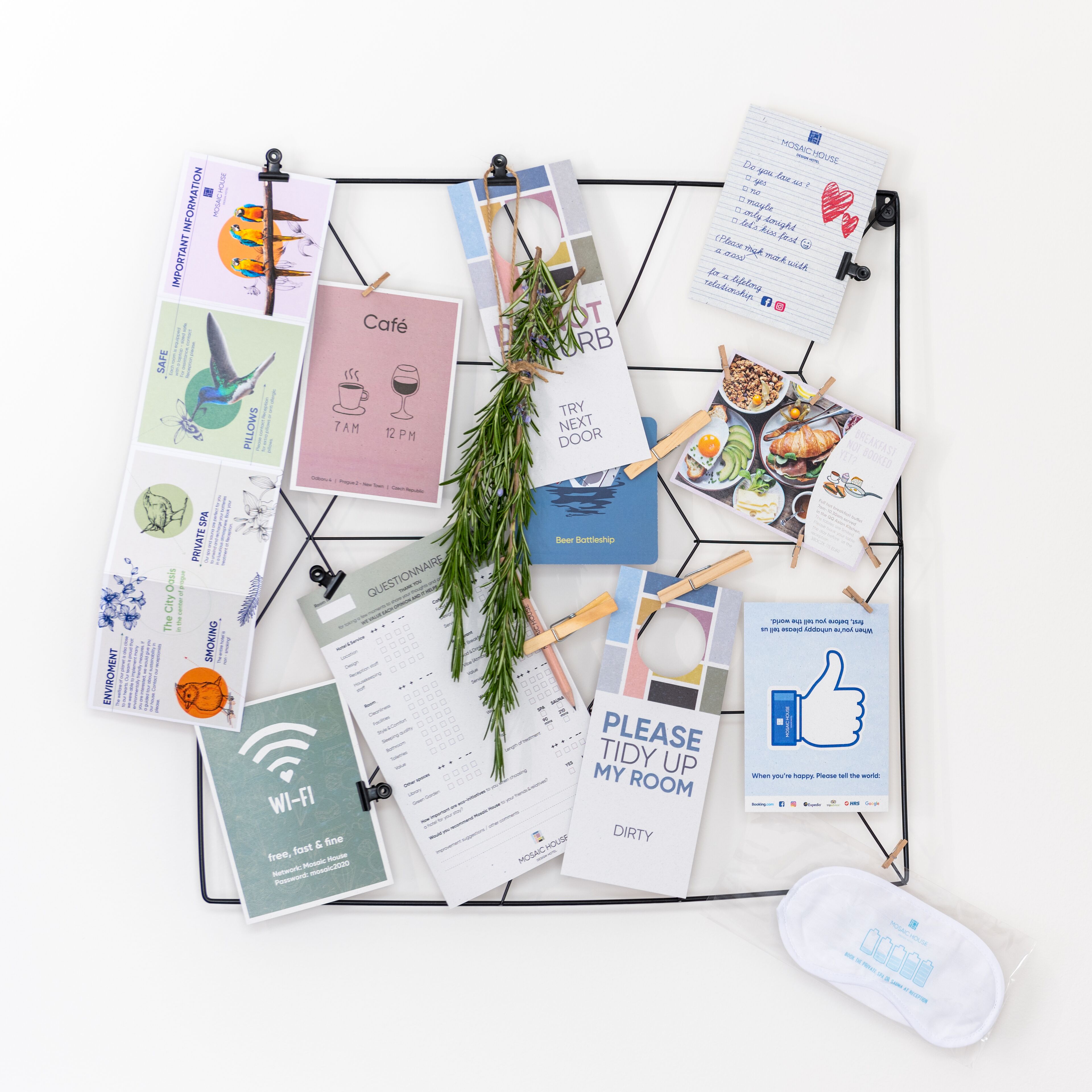 A bulletin board with various printed materials pinned to it, including a menu, a questionnaire, and a sign requesting room tidiness.