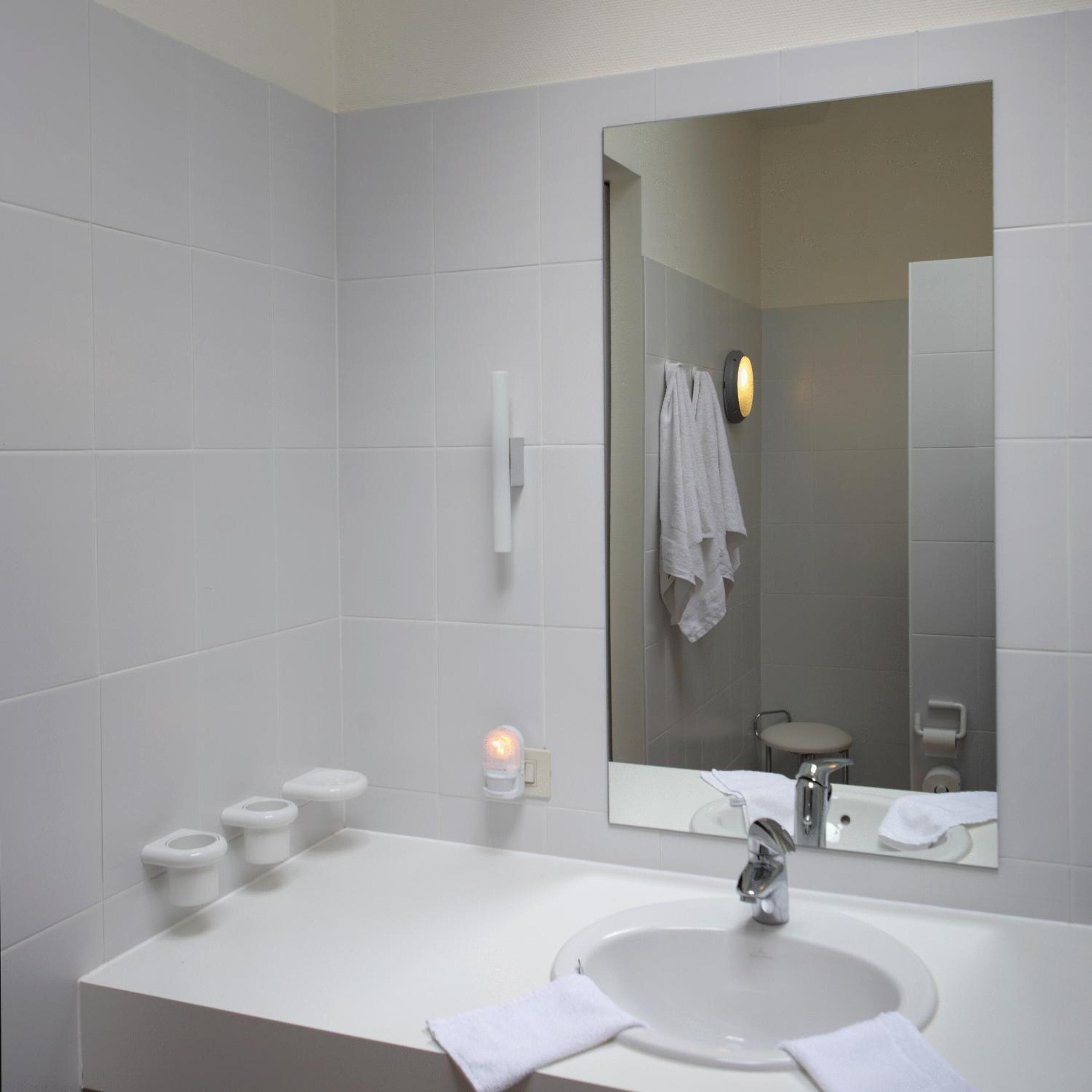 separate bathtub and shower, free toiletries, hair dryer, slippers