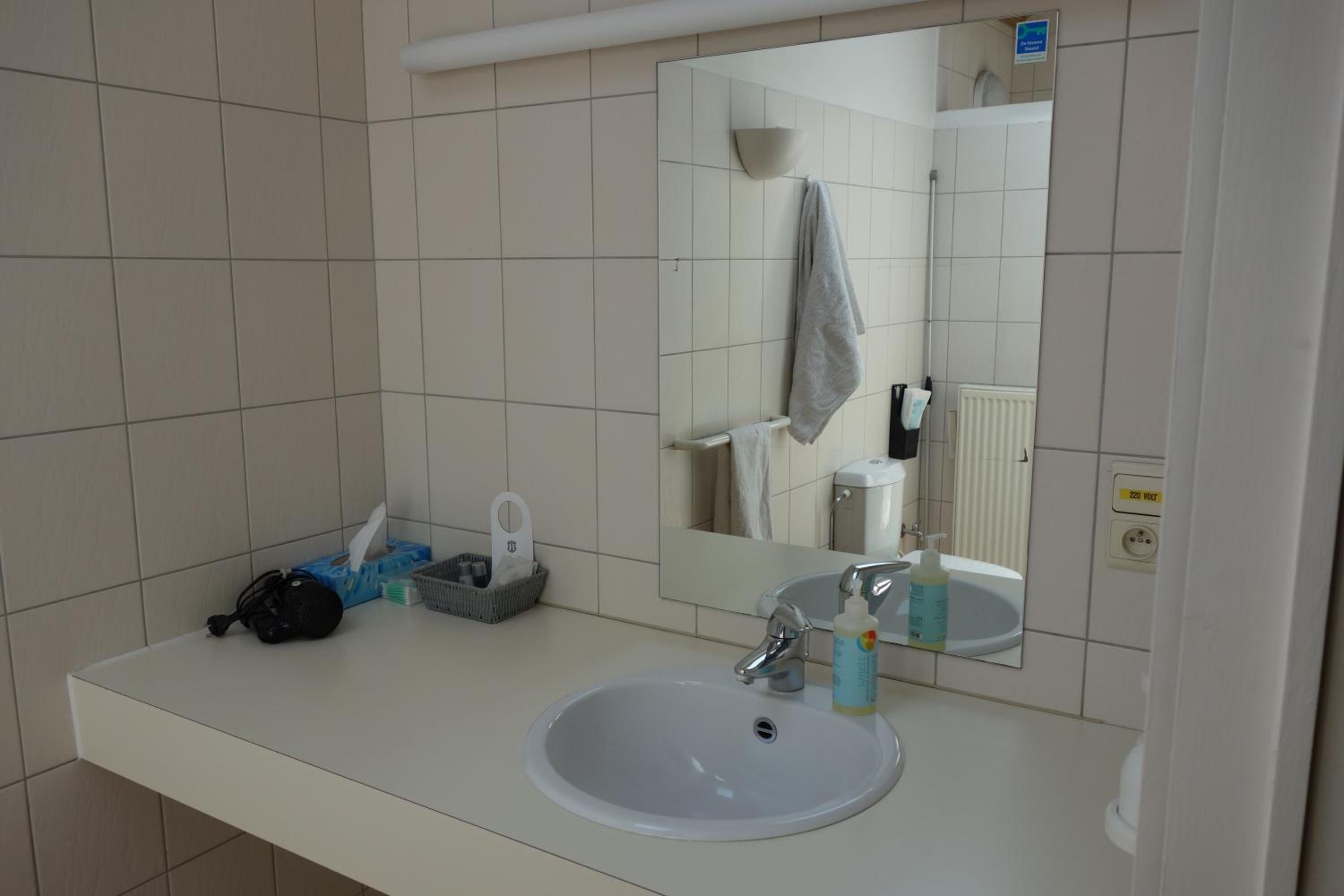 separate bathtub and shower, free toiletries, hair dryer, slippers