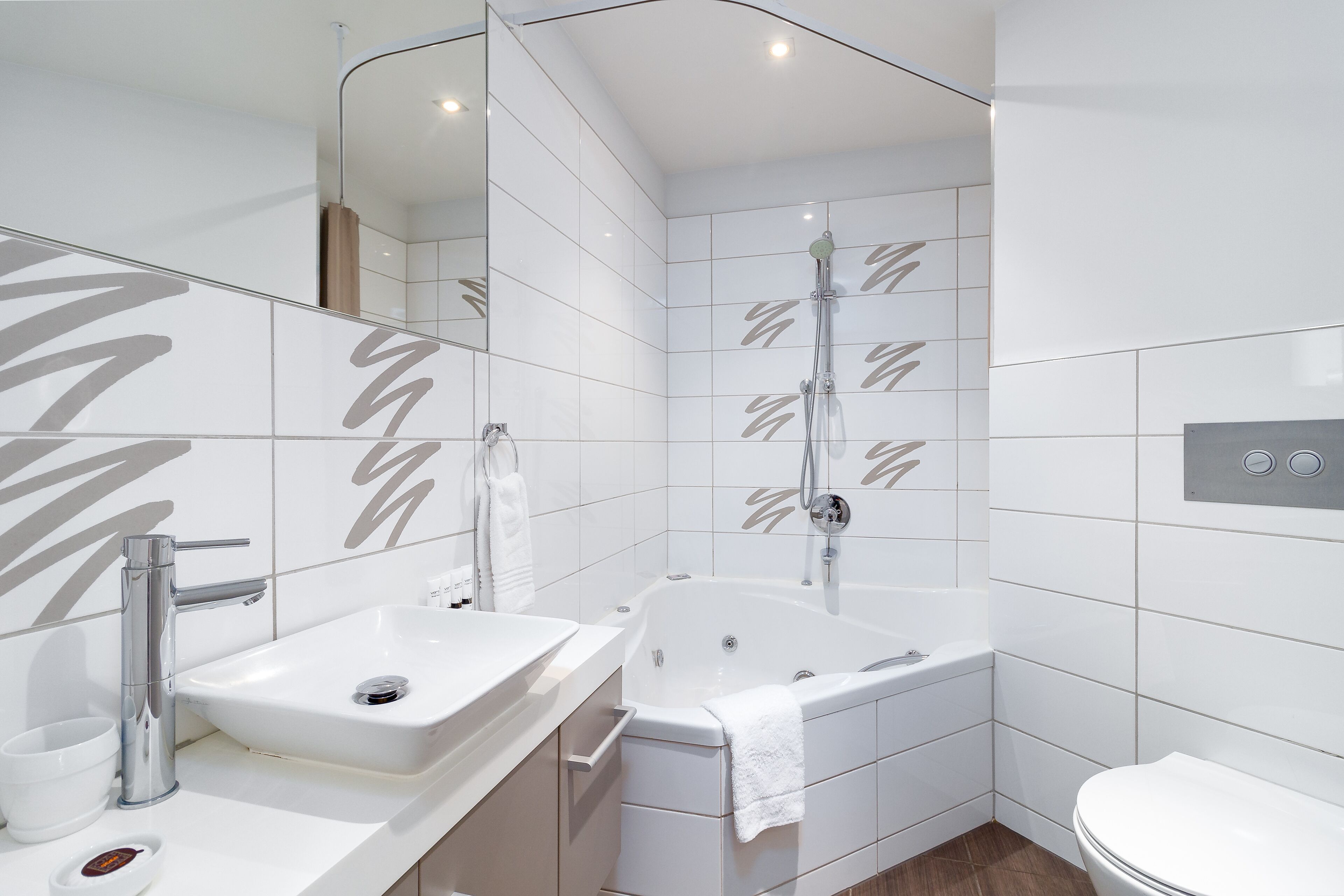 shower, designer toiletries, hair dryer, towels