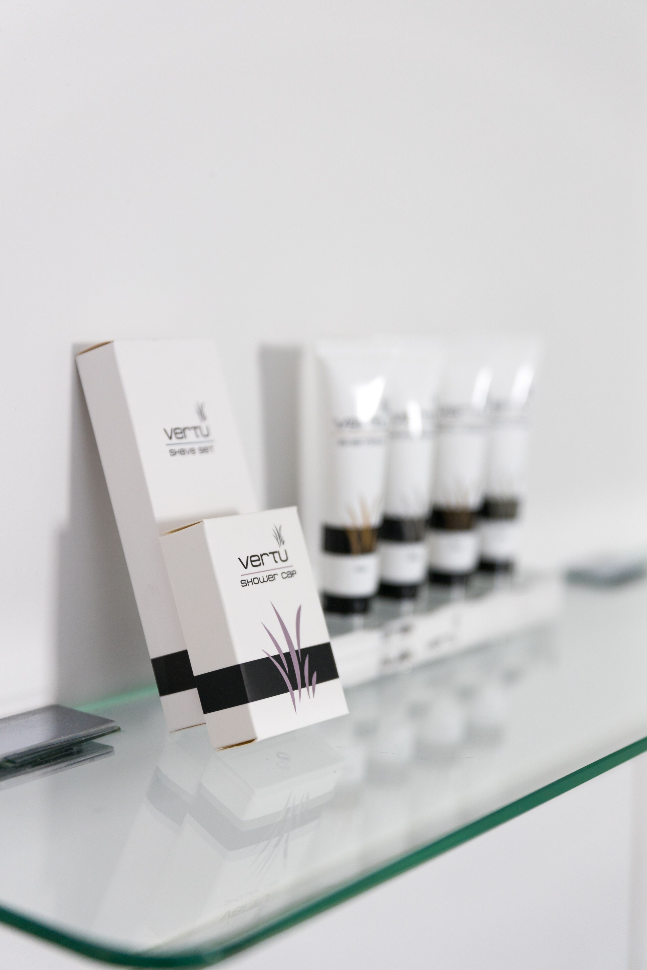 shower, designer toiletries, hair dryer, towels