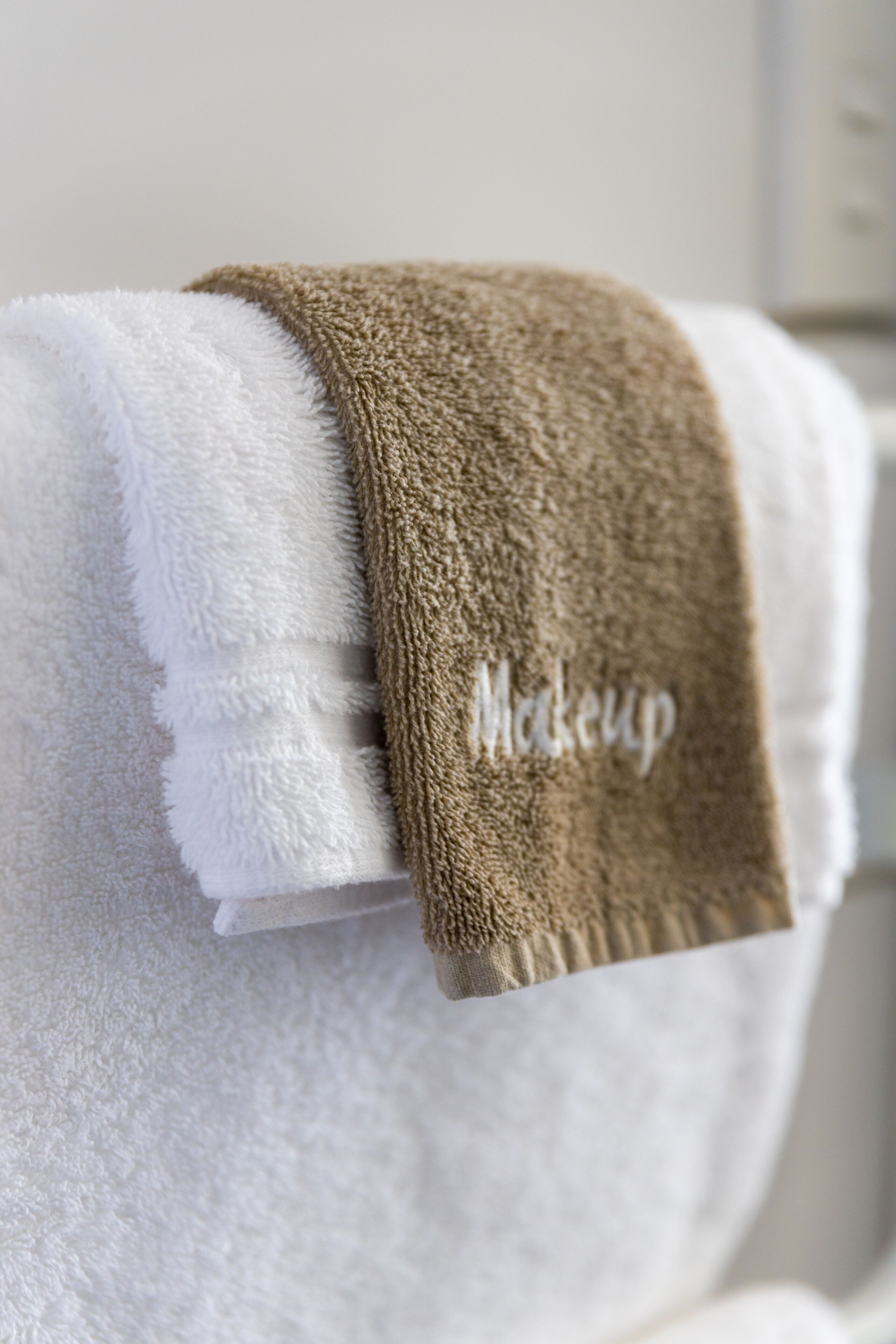 shower, designer toiletries, hair dryer, towels