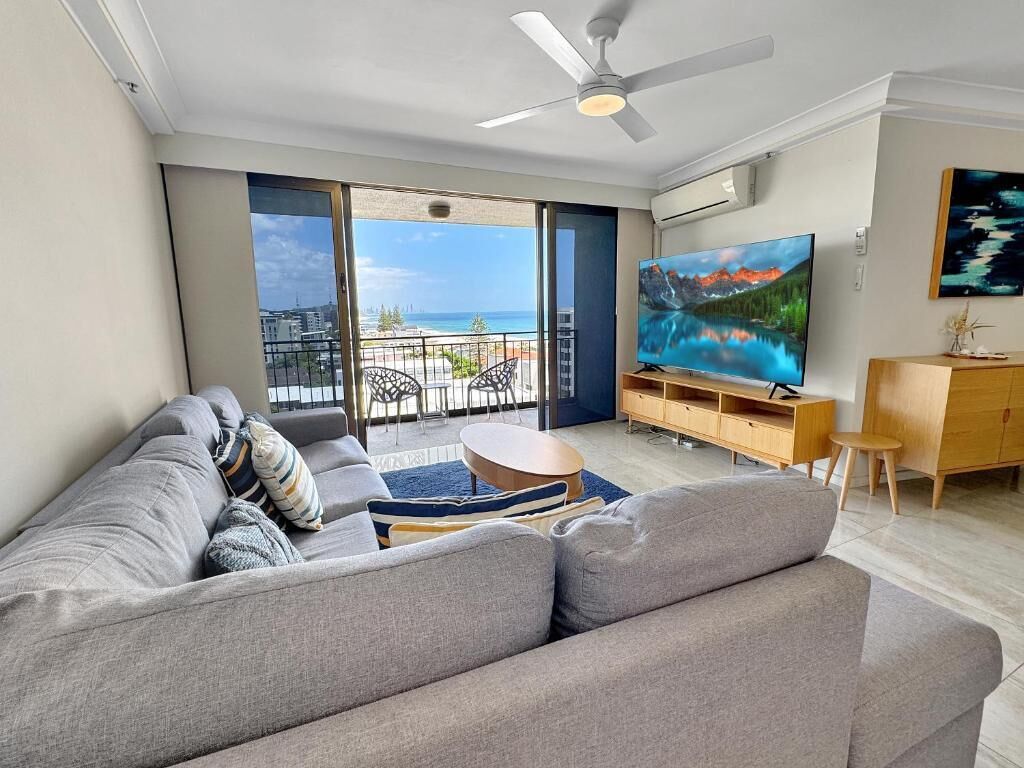 Superior Two Bedroom Apartment - Absolute Beach Front | Living area | 65-inch TV with cable channels