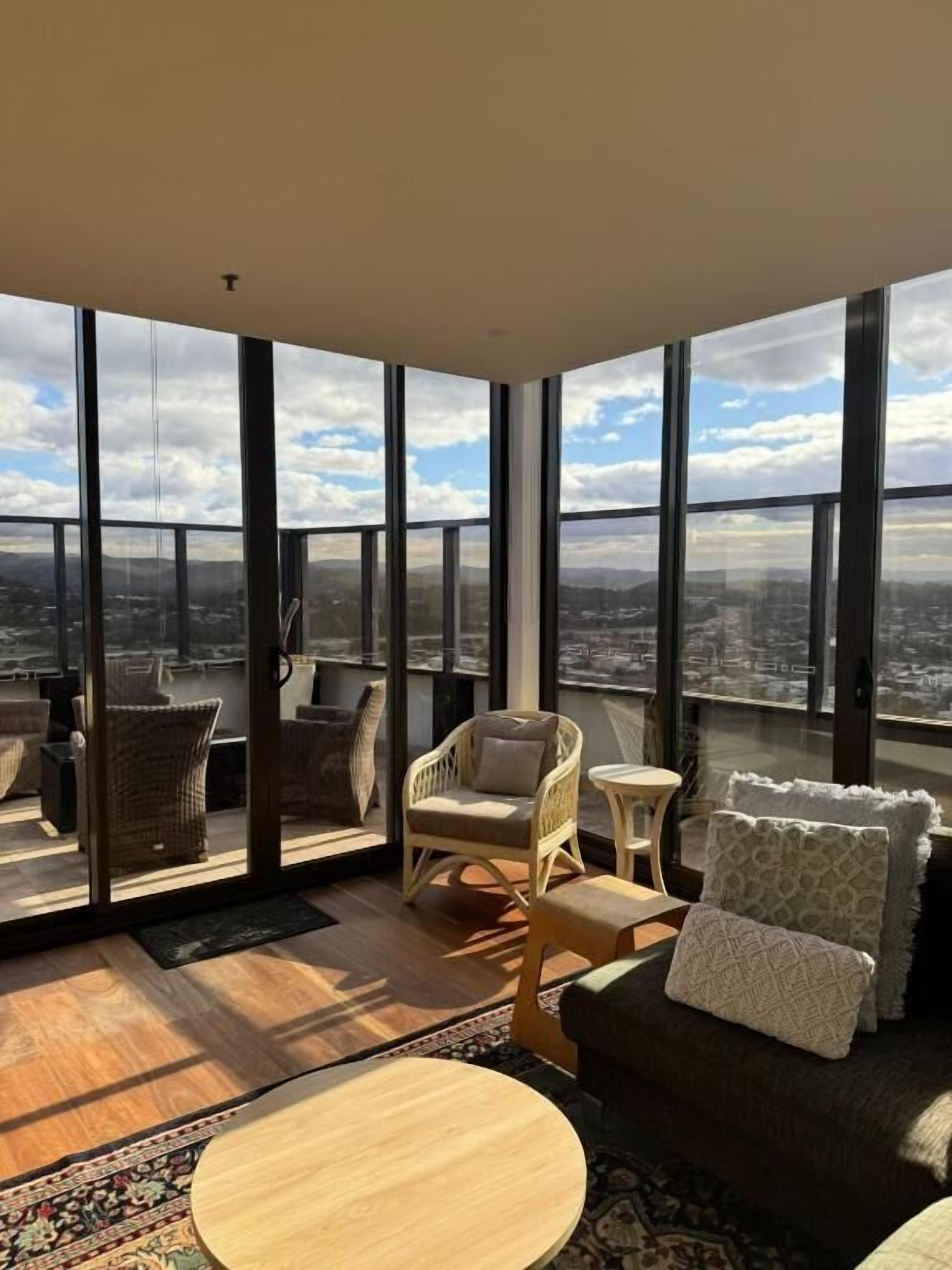 Three Bedroom Apartment - Absolute Beach Front | Living area | 65-inch TV with cable channels