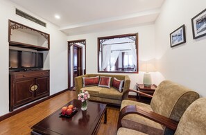 Premium Suite, 1 King Bed, Terrace, City View | Living room | 21-inch LCD TV with cable channels, TV, fireplace - La Dolce Vita (Hanoi)
