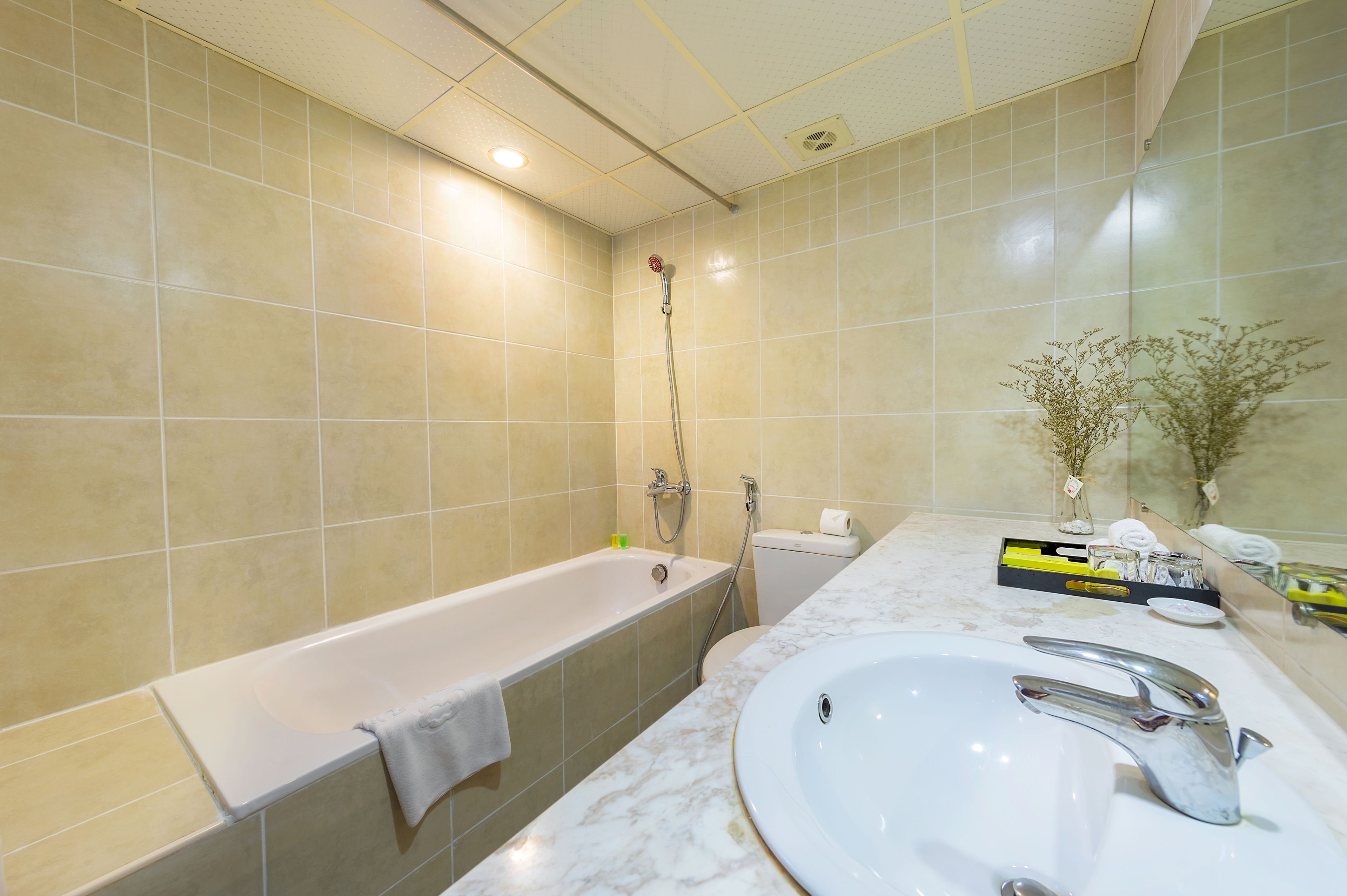 jetted bath, rainfall showerhead, designer toiletries, hair dryer