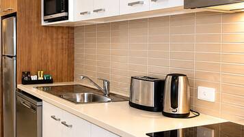 Microwave, stovetop, coffee/tea maker, cookware/dishes/utensils