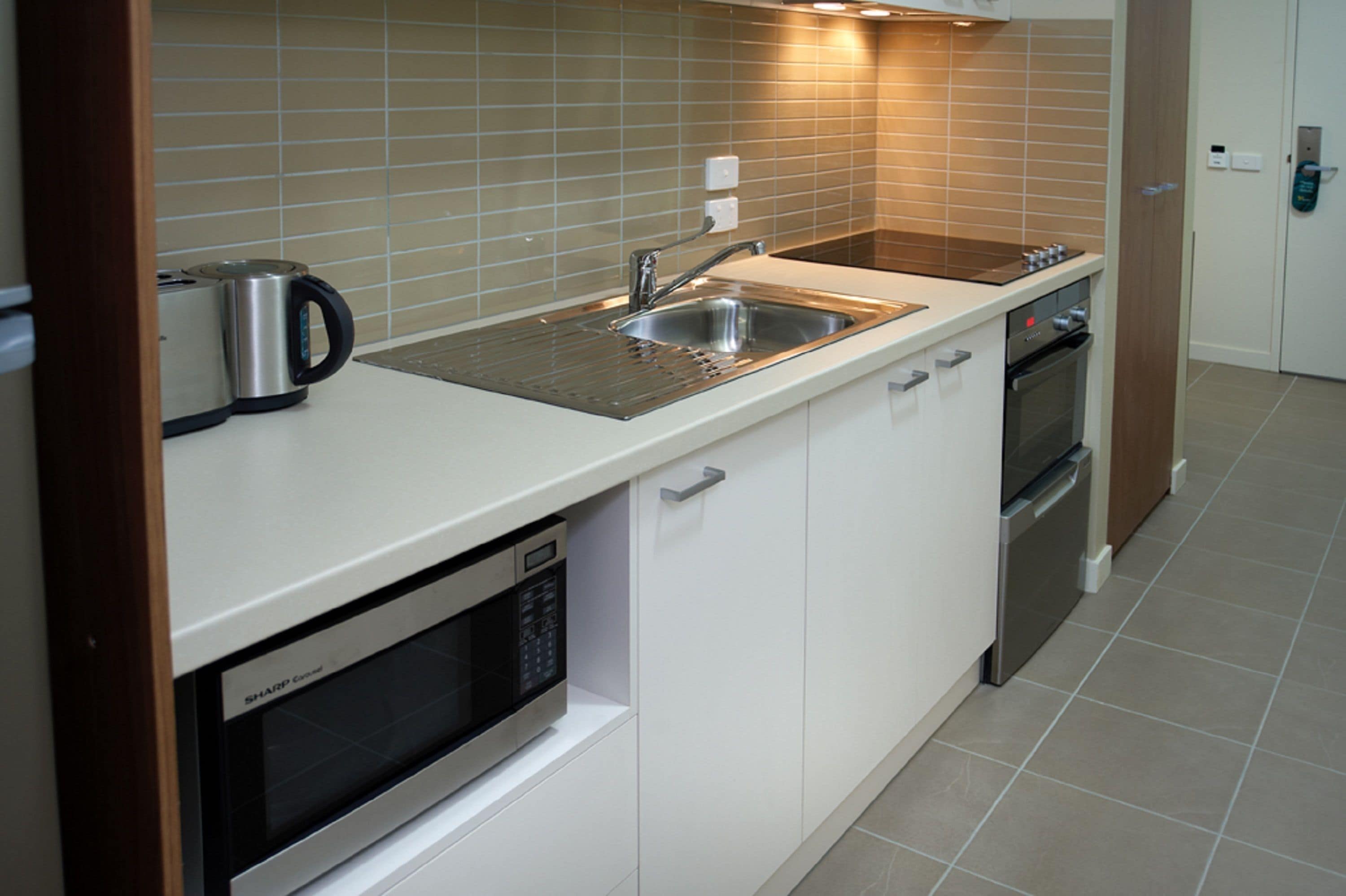 microwave, stovetop, coffee/tea maker, cookware/dishes/utensils