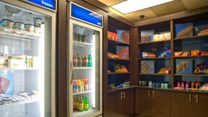 A refrigerated display case with various beverages and snacks. - Hampton Inn Anderson/ Alliance Business Park (Anderson)