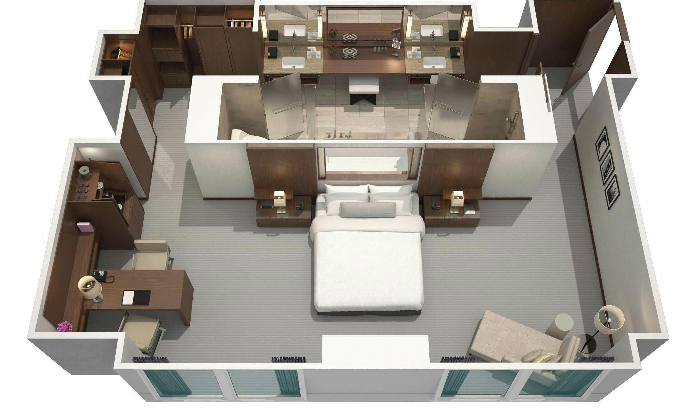 A modern hotel room with a large bed, two bedside tables, a desk, and a separate bathroom area.
