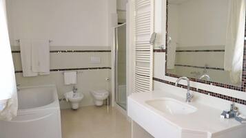 Shower, free toiletries, hair dryer, towels