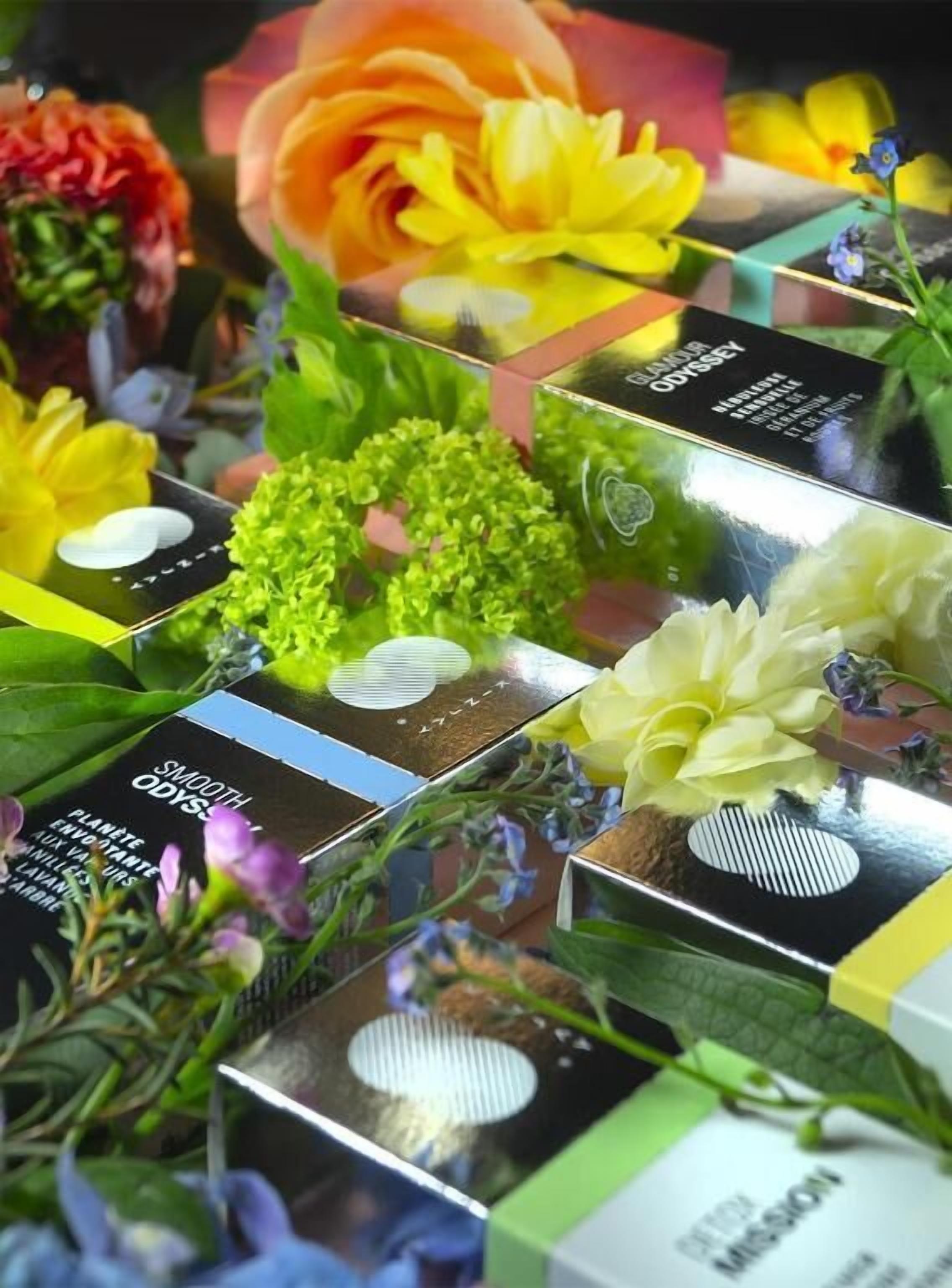 A display of various flower arrangements and plant boxes, likely part of a floral shop or garden center.