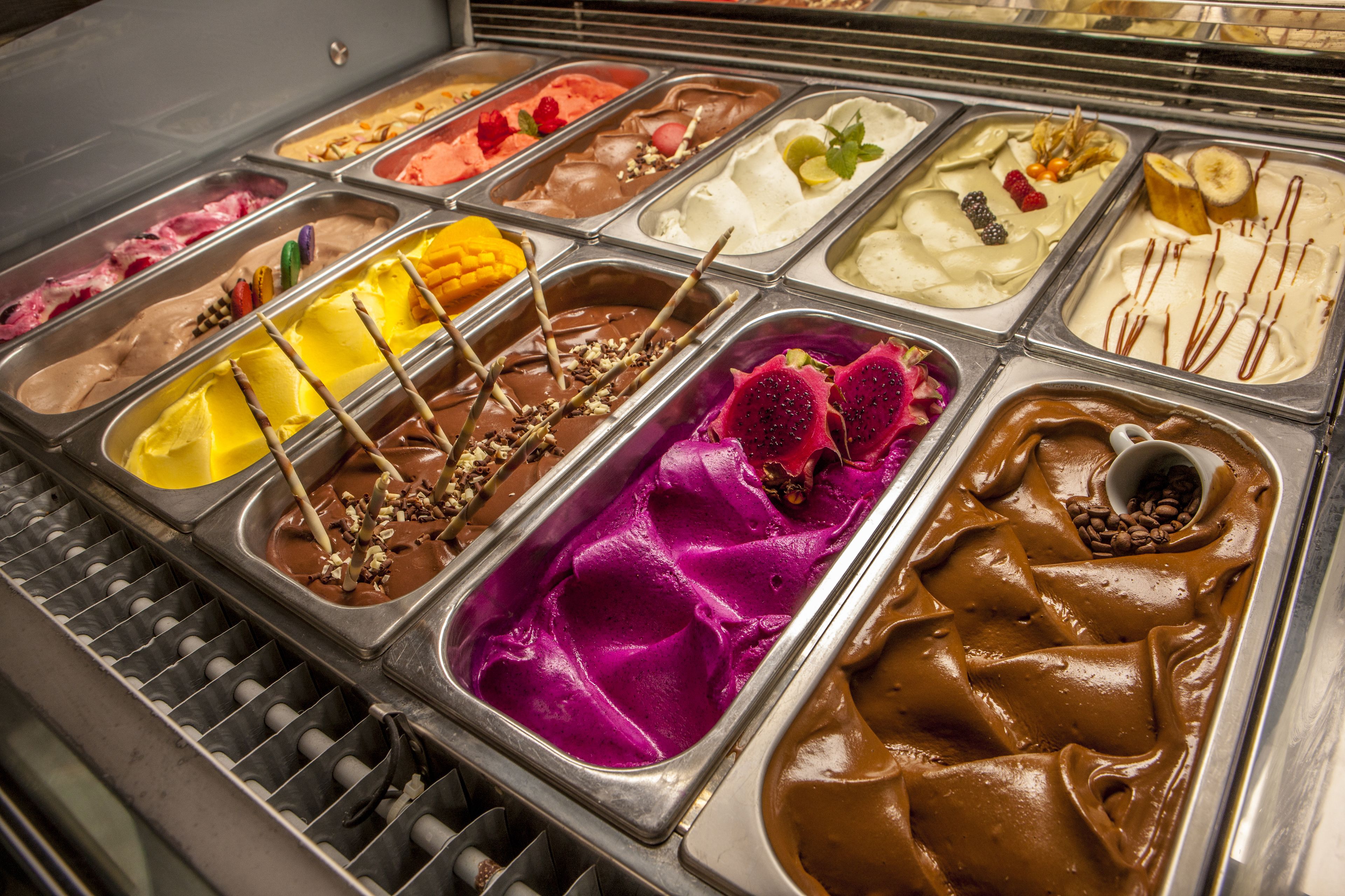 A variety of ice cream flavors in a display case.