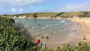 A coastal beach scene with people engaging in various activities. - Porth Veor Manor, Sure Hotel Collection by Best Western (Newquay)
